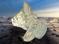 Ice sculpture on black sand