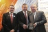 Mervyn Thomas and Peter Walsh, from Worcester Bosch sponsors of the Volume Housebuilder category, present Paul Cromby with the North Wales regional winners award.