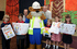 Redrow’s Jeff Dickinson, Buster Bear and David Ford pictured with children from Broadheath Primary School