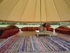 sides up enjoying the shade in a bell tent