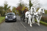 Electric car versus horse and carriage
