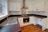 A contemporary fitted kitchen inside a restored home