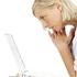 Woman looking at laptop