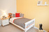 Honey tones in this child’s bedroom add warmth.