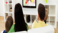 Family watching tv Family watching tv