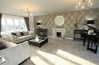 A baby grand piano emphasises the spaciousness of Elan’s show home lounge at The Larches.