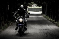 Why do some prefer motorcycles over cars?