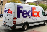What should you do if your vehicle is hit by a FedEx truck?